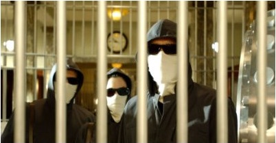 Masked robbers in a scene from the movie